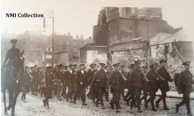 Rebels being led to the Dublin Docks for deportation, May 1916 (NMI Collection) Irish prisoners being marched under guard down Eden Quay for deportation to England (NMI Collection)