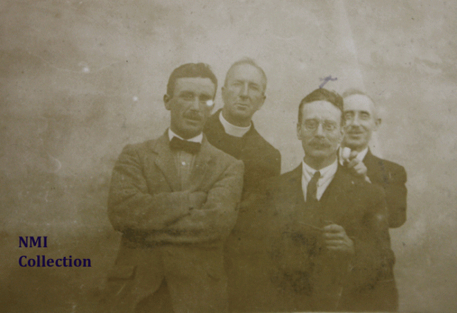 Liam Mellows in disguise with Alfie Monahan on his right, Father Sweetman with Sean Etchingham behind (NMI Collection)